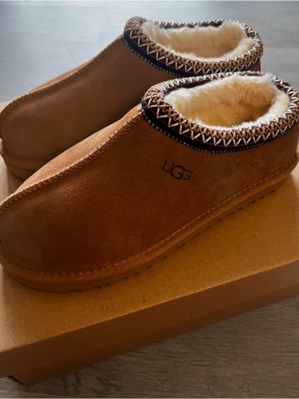 UGG women’s Suede Slip-On Clog in Chestnut with Cream Shearling